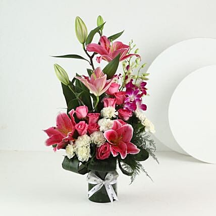 Elegant Mixed Flowers In Cylindrical Vase
